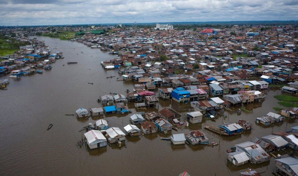 FILE - Boats navigate the Nanay River in the community of Belen in Iquitos, Peru, March 23, 2021. (AP Photo/Rodrigo Abd, File)