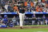Baltimore Orioles' Samuel Basallo flips his bat after hitting a walkoff home run during the ninth inning of a baseball game against the Los Angeles Dodgers, Friday, Sept. 5, 2025, in Baltimore. (AP Photo/Stephanie Scarbrough)