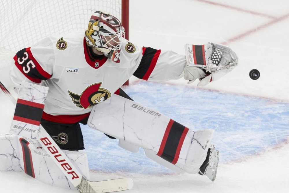 Ottawa Senators' goaltender Linus Ullmark (35) tips a Toronto Maple Leafs shot with his glove during third period NHL playoff action in Toronto on Sunday, April 20, 2025. THE CANADIAN PRESS/Nick Iwanyshyn