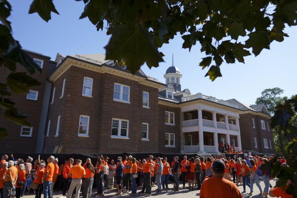 People line up to take a self-guided tour following the Official Unveiling of former Mohawk Institute Residential School as an Interpreted Historic Site at Woodland Cultural Centre in Brantford, Ont. on Tuesday, September 30, 2025. CANADIAN PRESS/Peter Power