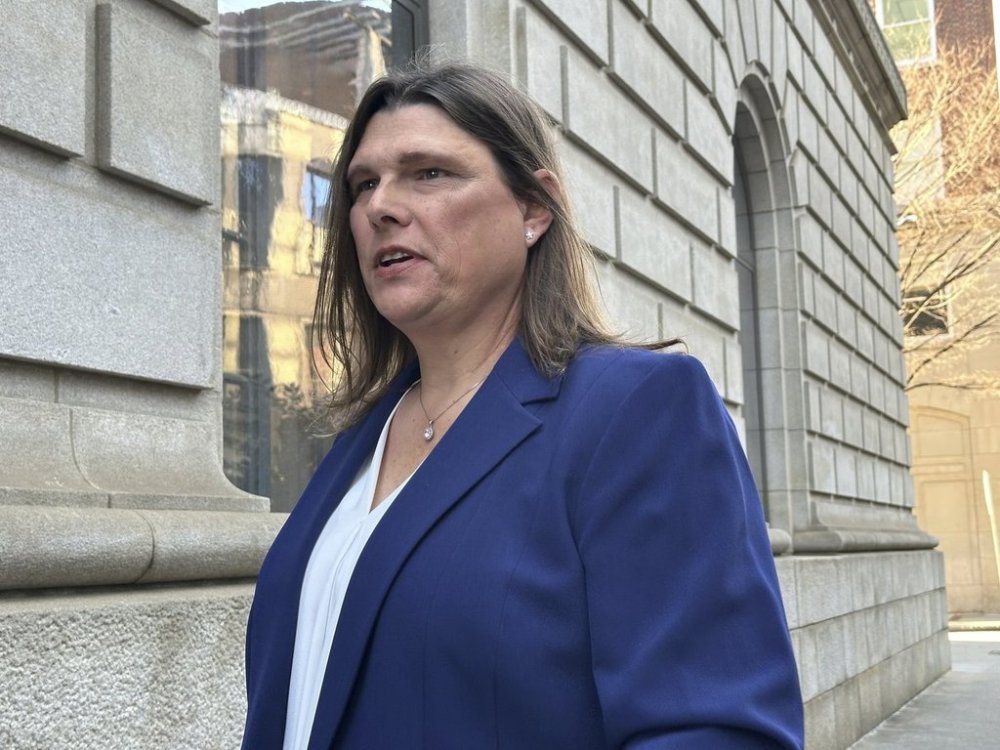 FILE - Anna Lange speaks to reporters on Tuesday, Feb. 4, 2025 in Atlanta after a federal appeals court hearing in which Houston County, Georgia, sought to overturn an order to pay for Lange's gender affirming care. (AP Photo/Jeff Amy, file)