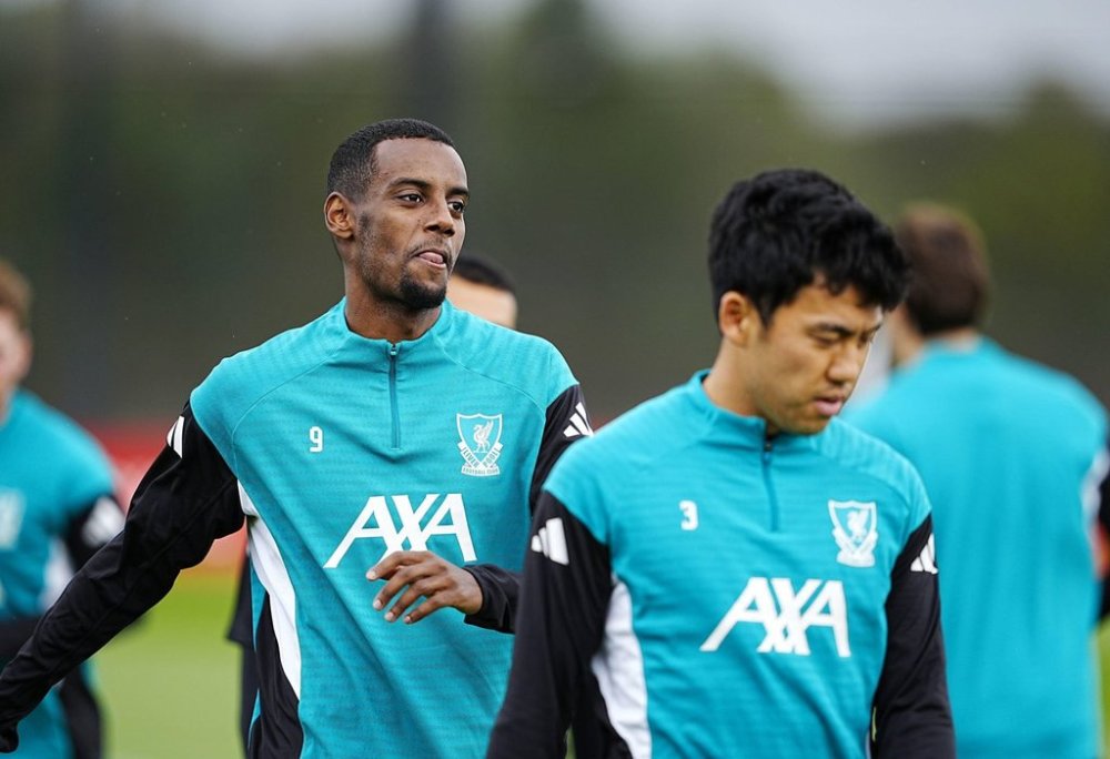 Liverpool's Alexander Isak, left, and Wataru Endo during a training session at the AXA Training Centre, Liverpool, England, Tuesday Sept. 16, 2025. (Peter Byrne/PA via AP)
