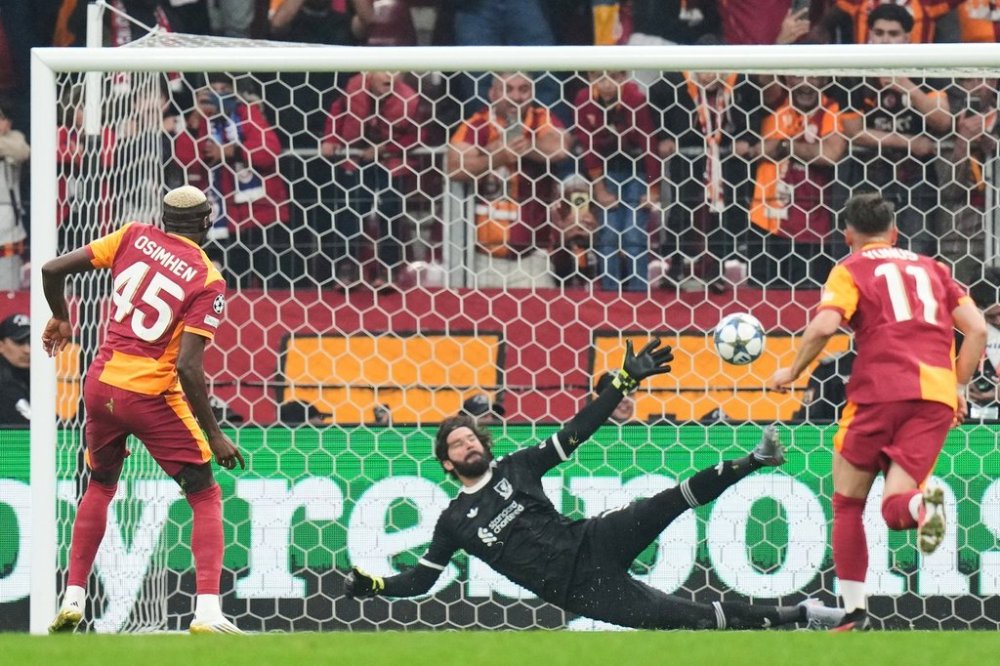 Galatasaray's Victor Osimhen shoots a penalty kick to score the opening goal during the Champions League opening phase soccer match between Galatasaray and Liverpool at the Ali Sami Yen stadium, in Istanbul, Turkey, Tuesday, Sept. 30, 2025. (AP Photo/Francisco Seco)