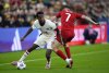 Canada's Ali Ahmed, left, and Wales' David Brooks in action during the international friendly soccer match between Wales and Canada at Swansea.com Stadium, Swansea, Wales, Tuesday Sept. 9, 2025. (Nick Potts/PA via AP)