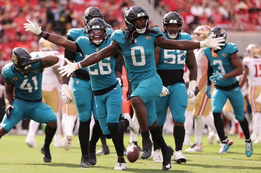 Jacksonville Jaguars linebacker Devin Lloyd (0) celebrates with teammates after intercepting a pass against the San Francisco 49ers during the second half of an NFL football game in Santa Clara, Calif., Sunday, Sept. 28, 2025. (AP Photo/Kelley L. Cox)