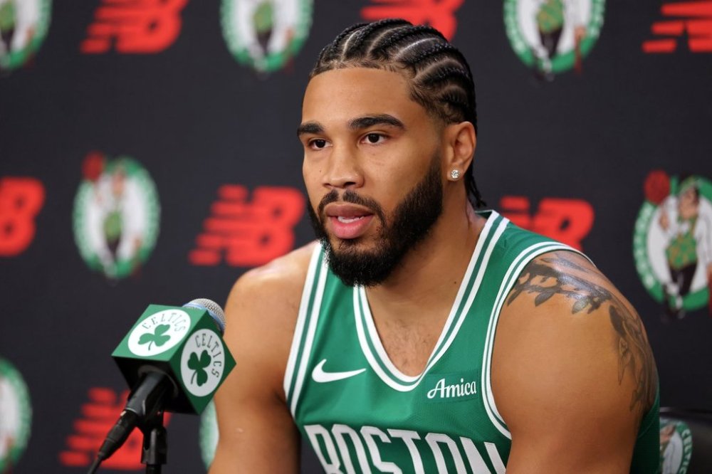 Boston Celtics' Jayson Tatum speaks at a news conference during the NBA basketball team's media day, Monday, Sept. 29, 2025, in Boston. (AP Photo/Michael Dwyer)