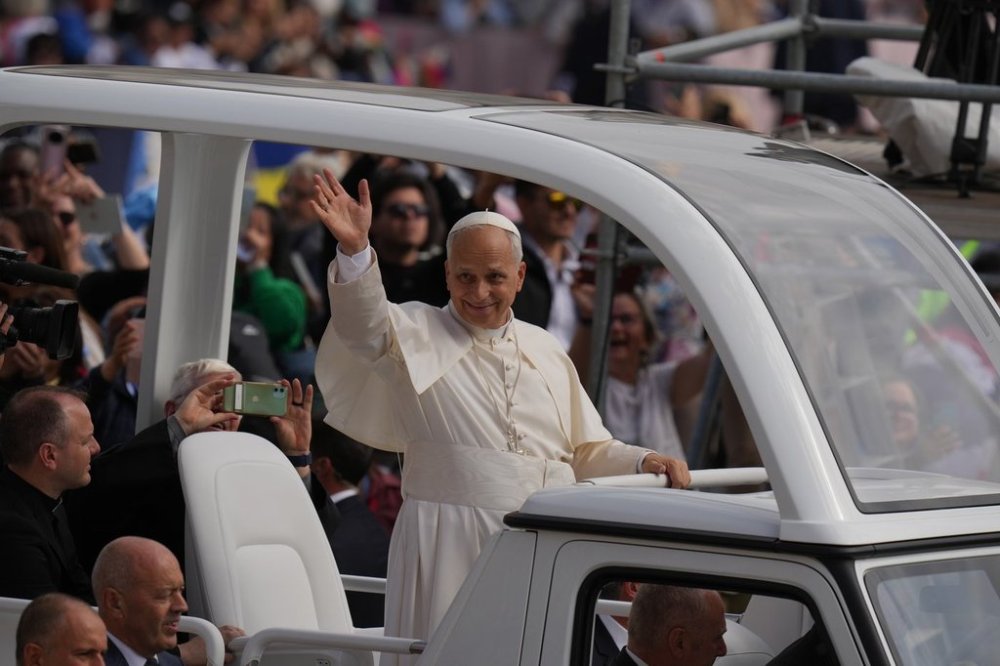 Pope Leo XIV waves from his popemobile at the end of a Mass for the Jubilee of Migrants and Missionaries in St. Peter's Square at the Vatican, Sunday, Oct. 5, 2025. (AP Photo/Alessandra Tarantino)