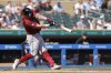 Arizona Diamondbacks' James McCann hits a three-run home run during the fourth inning of a baseball game against the Minnesota Twins, Sunday, Sept. 14, 2025, in Minneapolis. (AP Photo/Bailey Hillesheim)