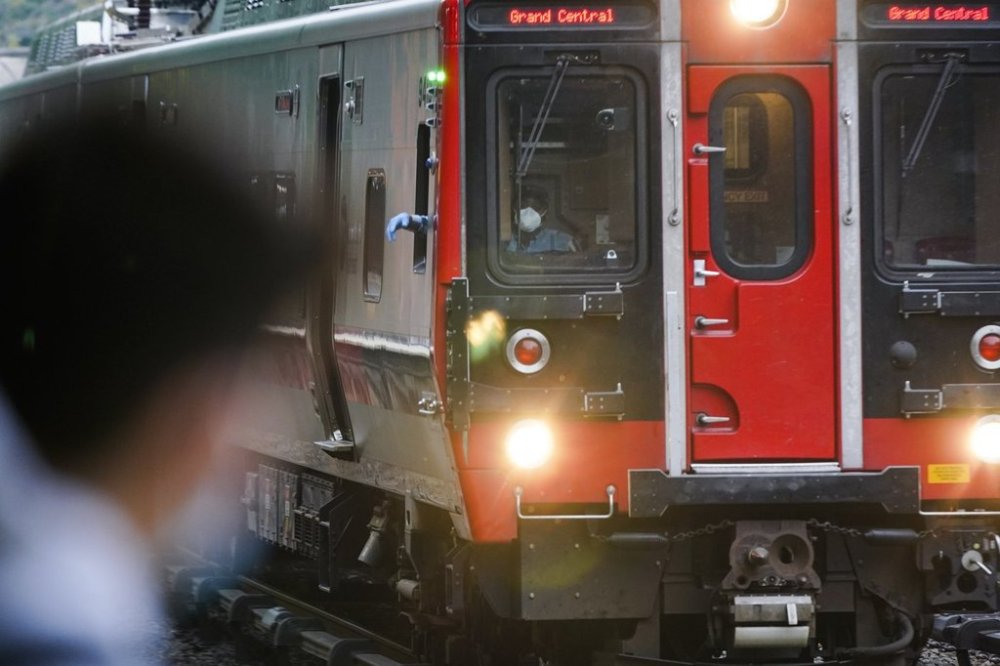 FILE - A train operator watches a train at the Fordham Metro North station Thursday, Oct. 22, 2020, in New York. (AP Photo/Frank Franklin II, File)