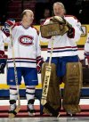Former Canadiens goaltender Ken Dryden, right, takes his famous pose as he chats with former teammate Steve Shutt during centennial celebrations on Friday, December 4, 2009, in Montreal. THE CANADIAN PRESS/Paul Chiasson