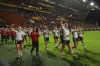 Canada's team players celebrate after winning the Women's Rugby World Cup 2025 semifinal match between New Zealand and Canada in Bristol, England, Friday, Sept. 19, 2025. (AP Photo/Anthony Upton)