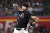 Arizona Diamondbacks pitcher Zac Gallen throws against the Philadelphia Phillies in the first inning of a baseball game, Saturday, Sept. 20, 2025, in Phoenix. (AP Photo/Rick Scuteri)