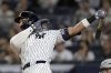 New York Yankees' Aaron Judge hits a home run during the first inning of a baseball game against the Detroit Tigers, Thursday, Sept. 11, 2025, in New York. (AP Photo/Adam Hunger)