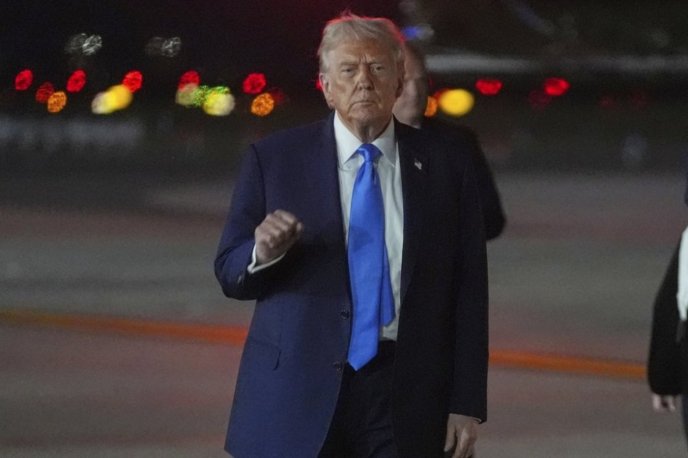 President Donald Trump gestures as he arrives on Air Force One at John F. Kennedy International Airport on Monday, Sept. 22, 2025, in New York. (AP Photo/Evan Vucci)