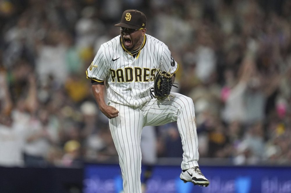San Diego Padres relief pitcher Bradgley Rodriguez celebrates after the third out during the eleventh inning of a baseball game against the Milwaukee Brewers Monday, Sept. 22, 2025, in San Diego. (AP Photo/Gregory Bull)