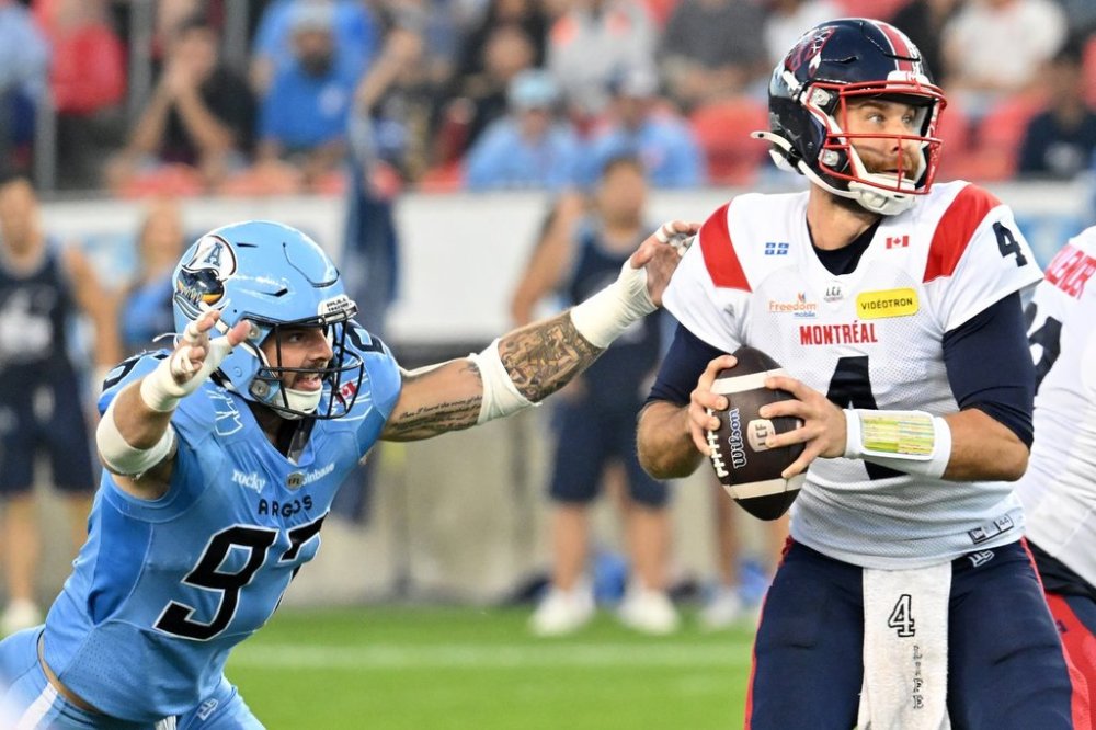 Montreal Alouettes quarterback McLeod Bethel-Thompson (4) is sacked by Toronto Argonauts defensive lineman Derek Parish (97) during first half CFL football action in Toronto Friday, Sept. 19, 2025. THE CANADIAN PRESS/Jon Blacker