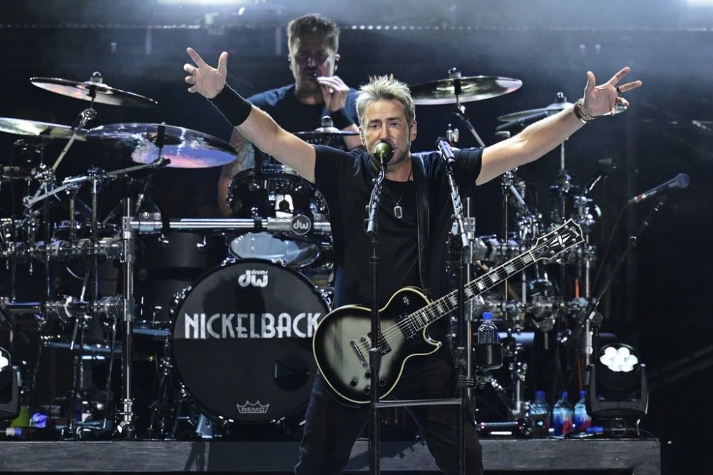 Chad Kroeger, front, of Nickelback, performs during a concert Sunday, Aug. 3, 2025, at the Pro Football Hall of Fame in Canton, Ohio. (AP Photo/David Dermer)