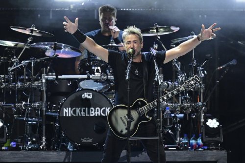 Chad Kroeger, front, of Nickelback, performs during a concert Sunday, Aug. 3, 2025, at the Pro Football Hall of Fame in Canton, Ohio. (AP Photo/David Dermer)