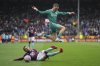 Liverpool's Florian Wirtz escapes a tackle by Burnley's Quilindschy Hartman during the Premier League soccer match between Burnley and Liverpool in Burnley, England, Sunday, Sept. 14, 2025. (AP Photo/Jon Super)