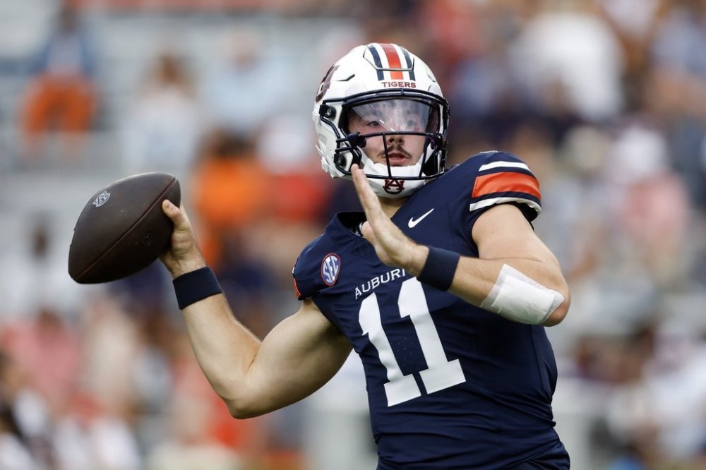 Auburn quarterback Jackson Arnold (11) warms up before an NCAA college football game against Ball State, Saturday, Sept. 6, 2025, in Auburn, Ala. (AP Photo/Butch Dill)