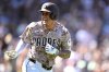 San Diego Padres' Manny Machado gestures toward his dugout after hitting a solo home run against the Arizona Diamondbacks during the third inning of a baseball game Sunday, Sept. 28, 2025, in San Diego. (AP Photo/Orlando Ramirez)
