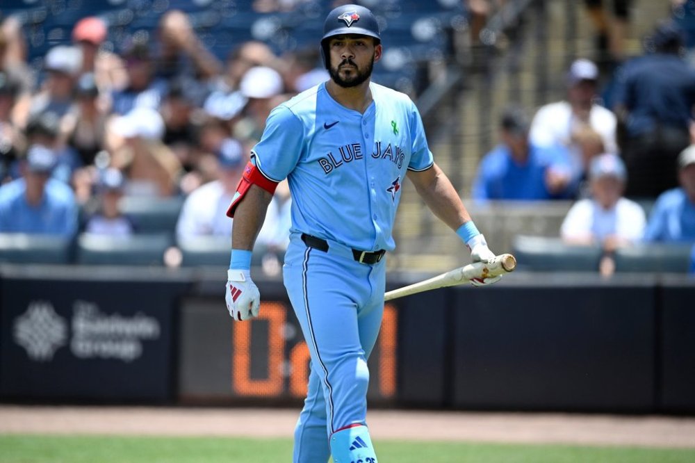 FILE — Toronto Blue Jays' Anthony Santander walks back to the dugout after striking out during the first inning of a baseball game against the Tampa Bay Rays, May 25, 2025, in Tampa, Fla. (AP Photo/Phelan M. Ebenhack, File)