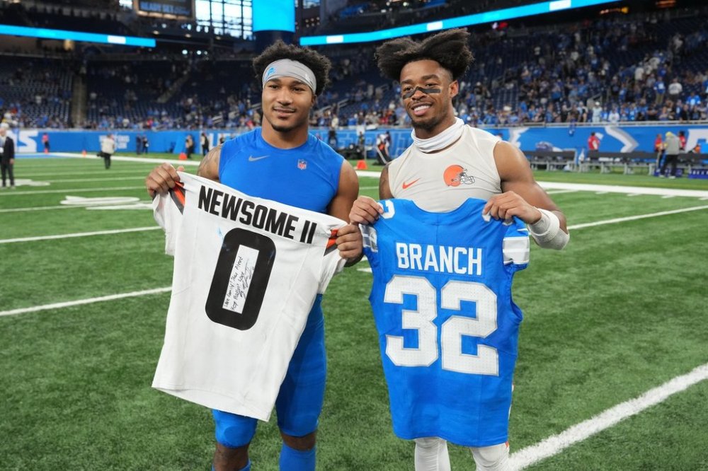 Detroit Lions safety Brian Branch, left, and Cleveland Browns' Greg Newsome II pose following an NFL football game, Sunday, Sept. 28, 2025, in Detroit. (AP Photo/Paul Sancya)