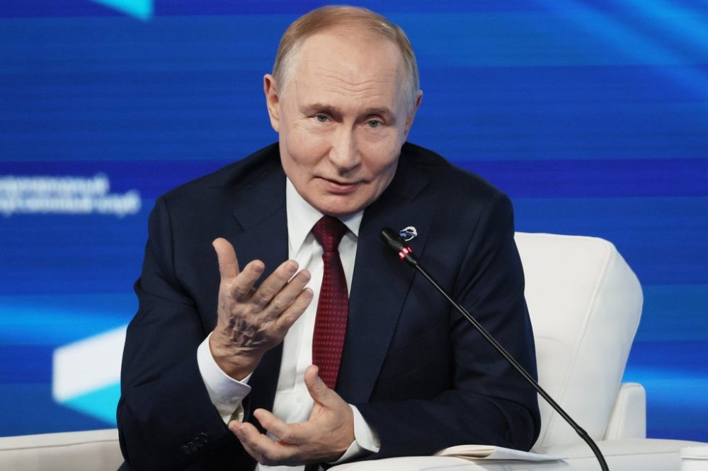 Russian President Vladimir Putin gestures as he answers questions during a meeting with foreign policy experts at the Valdai Discussion Club in the Black Sea resort of Sochi, Russia, on Thursday, Oct. 2, 2025. (Mikhail Metzel, Sputnik, Kremlin Pool Photo via AP)