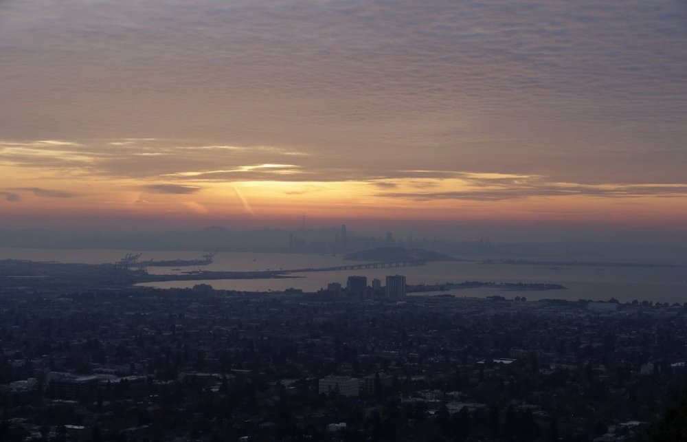 FILE - The San Francisco skyline and the eastern span of the Bay Bridge are shown from Berkeley, Calif., Dec. 22, 2017. (AP Photo/Jeff Chiu, file)