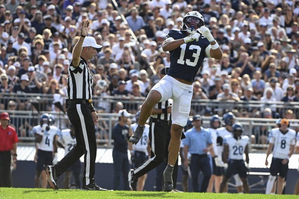Penn State linebacker Tony Rojas (13) celebrates after sacking Villanova quarterback Tanner Maddocks (3) during the second quarter of an NCAA college football game, Saturday, Sept. 13, 2025, in State College, Pa. (AP Photo/Barry Reeger)