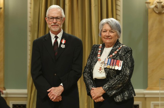 Freelance writer John Longhurst is invested as a member of the Order of Canada by Governor General Mary Simon during a ceremony at Rideau Hall in Ottawa last Thursday. (Patrick Doyle / The Canadian Press)