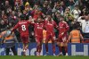 Liverpool's Ryan Gravenberch, second right, celebrates with teammates after scoring his side's opening goal during the English Premier League soccer match between Liverpool and Everton at Anfield stadium in Liverpool, England, Saturday, Sept. 20, 2025. (AP Photo/Rui Vieira)
