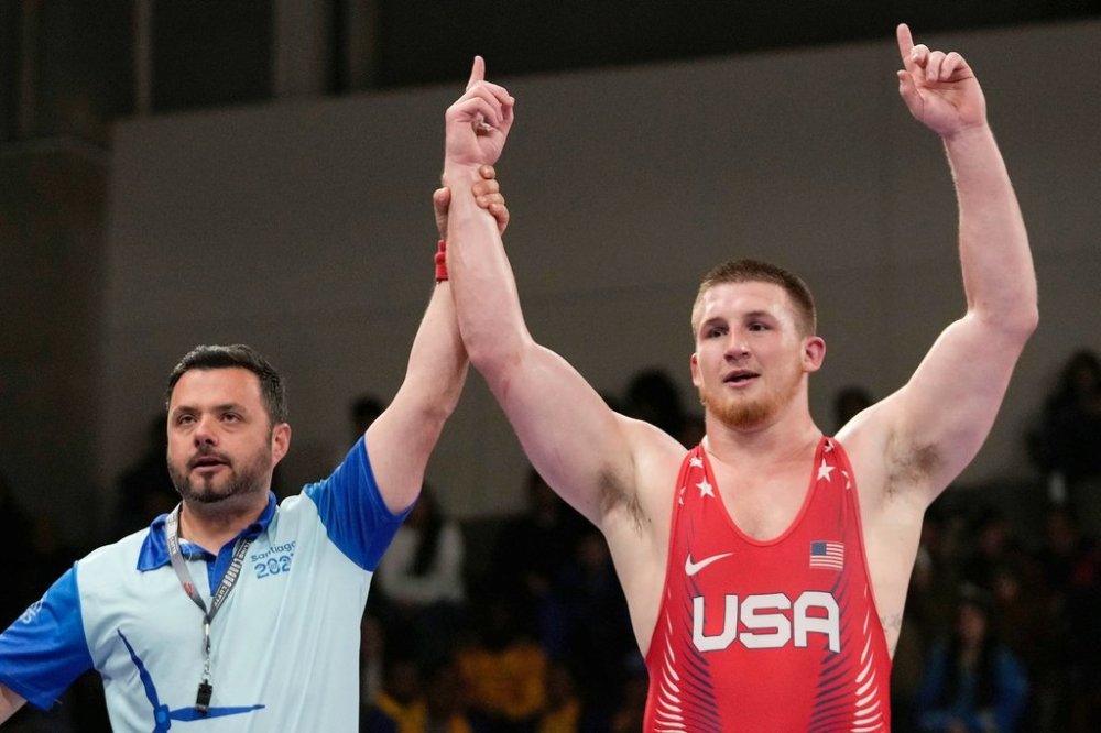 FILE - United States's Mason Parris, right, is declared the winner following the men's 125kg wrestling freestyle gold medal bout against against Venezuela's Jose Diaz at the Pan American Games Santiago, Chile, Wednesday, Nov. 1, 2023. (AP Photo/Matias Delacroix, File)