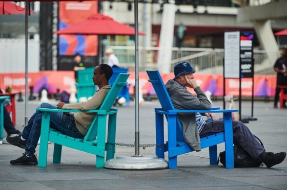 People rest at Sankofa Square in Toronto, on Friday. (Sammy Kogan / The Canadian Press)