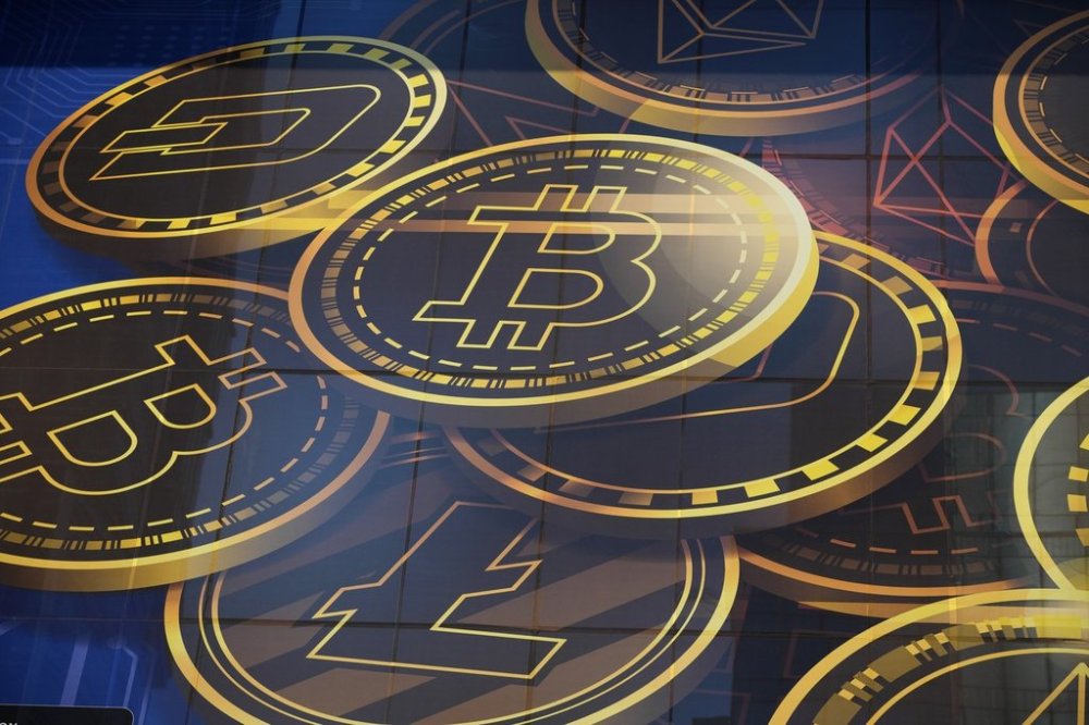 An advertisement for cryptocurrency Bitcoin is displayed on a building in Hong Kong, on Nov. 18, 2021. THE CANADIAN PRESS/AP-Kin Cheung