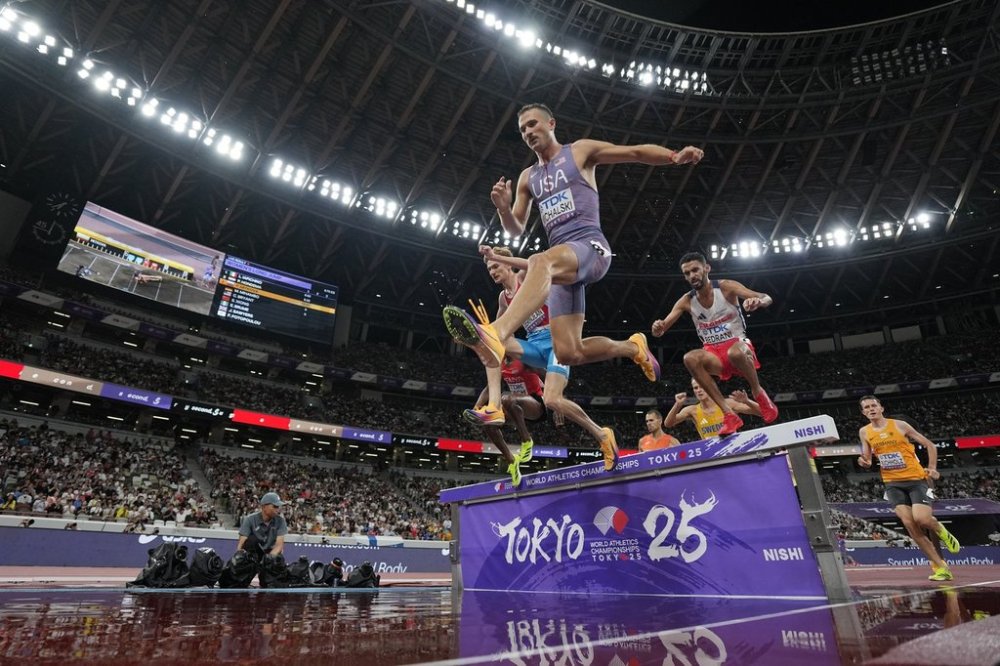 United States' Daniel Michalski, center, Luxembourg's Ruben Querinjean, left, and France's Djilali Bedrani, right, compete in a men's 3,000 meters steeplechase heat at the World Athletics Championships in Tokyo, Saturday, Sept. 13, 2025. (AP Photo/Ashley Landis)