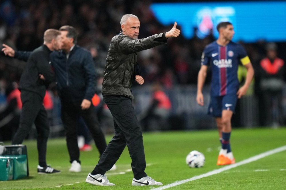PSG's head coach Luis Enrique gestures during the French League One soccer match between Paris Saint-Germain and Auxerre at the Parc des Princes in Paris, Saturday, Sept. 27, 2025. (AP Photo/Thibault Camus)