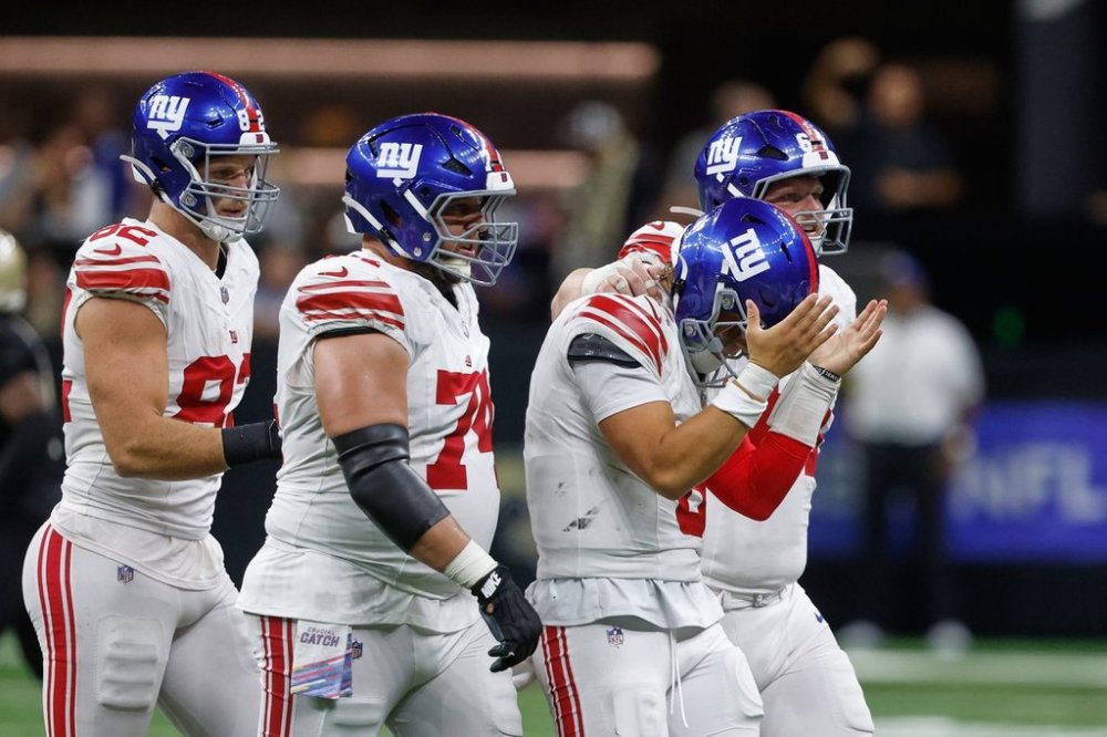 New York Giants quarterback Jaxson Dart reacts after his fumble in the second half of an NFL football game against the New Orleans Saints in New Orleans, Sunday, Oct. 5, 2025. (AP Photo/Butch Dill)