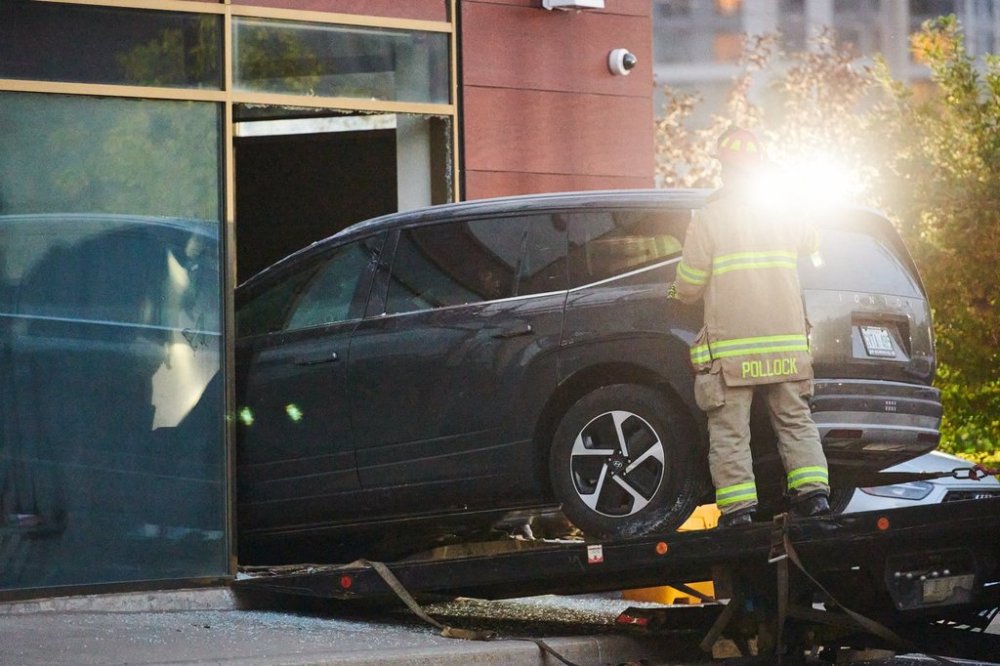 Police and fire crews work to remove a vehicle from First Roots Early Education Academy after it was driven through the daycare's window in Richmond Hill, Ont., on Wednesday, Sept. 10, 2025. THE CANADIAN PRESS/Sammy Kogan
