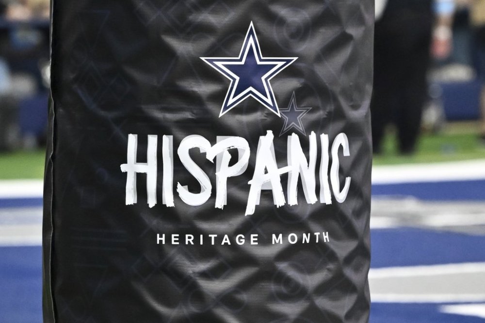 A detail view of a Hispanic Heritage Month goal post wrap during the second half of an NFL football game between the Baltimore Ravens and the Dallas Cowboys, Sunday, Sept. 22, 2024, in Arlington, Texas. The Ravens defeated the Cowboys 28-25. (AP Photo/Maria Lysaker)