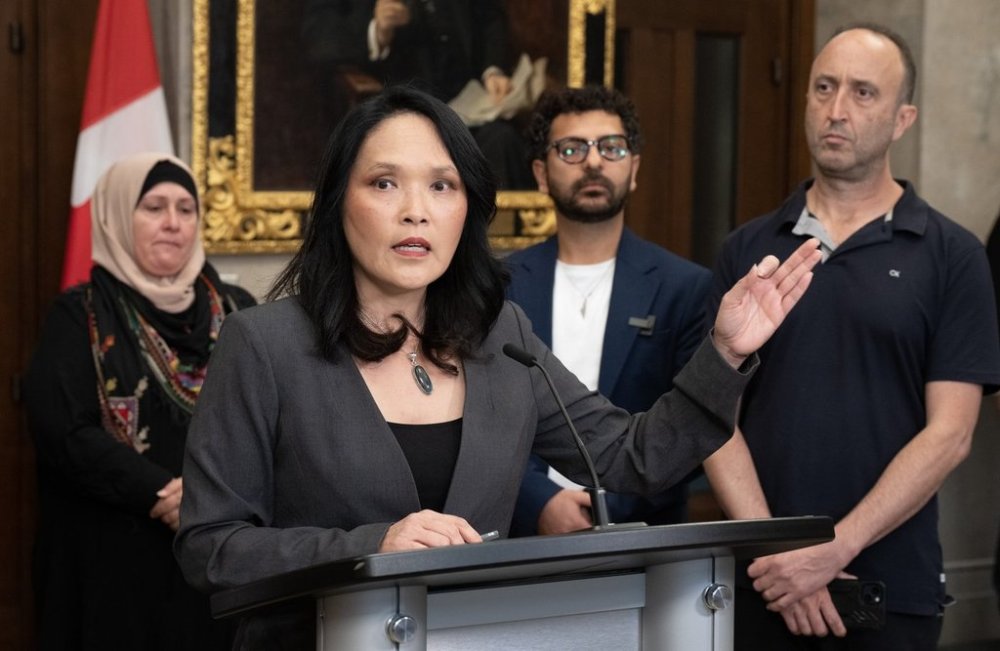 Nahil Alatbash, Gaza Canadians League founder Omar Omar and Gur Tsabar of the Jews Say No to Genocide Coalition (right), look on as NDP MP for Vancouver East Jenny Kwan speaks during a news conference on Parliament Hill on Monday, Sept. 22, 2025 in Ottawa. THE CANADIAN PRESS/Adrian Wyld