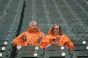Fans sit in the stands as drizzle falls while waiting for the start of Game 3 of baseball's American League Division Series between the Detroit Tigers and the Seattle Mariners Tuesday, Oct. 7, 2025, in Detroit. (AP Photo/Paul Sancya)