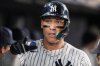 New York Yankees' Aaron Judge celebrates with teammates after hitting a two-run home run during the third inning of a baseball game against the Baltimore Orioles Friday, Sept. 26, 2025, in New York. (AP Photo/Frank Franklin II)