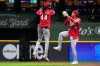 Cincinnati Reds' Elly De La Cruz and Noelvi Marte celebrate after a baseball game against the Milwaukee Brewers Friday, Sept. 26, 2025, in Milwaukee. (AP Photo/Morry Gash)