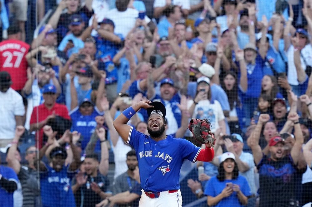 Toronto Blue Jays first base Vladimir Guerrero Jr. (27) celebrates as the Toronto Blue Jays win the American League East Division title over the Tampa Bay Rays following MLB baseball action in Toronto, Sunday, Sept. 28, 2025. THE CANADIAN PRESS/Chris Young