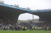 Sheffield Wednesday fans invade the pitch in protest against the club's owner Dejphon Chansiri during the Championship soccer match at Hillsborough stadium, Sheffield, England, Saturday Oct. 4, 2025. (Nigel French/PA via AP)
