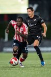 Ottawa Atletico's Ballou Tabla (13) and Vancouver FC's David Norman Jr. (13) vie for the ball during second half Canadian Championship semifinal soccer action, in Langley, B.C., on Wednesday, August 13, 2025. THE CANADIAN PRESS/Ethan Cairns