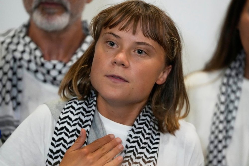 Swedish activist Greta Thunberg speaks as she arrives at the Eleftherios Venizelos International Airport in Athens, Monday, Oct. 6, 2025 after being deported from Israel for taking part in a Gaza-bound aid flotilla. (AP Photo/Petros Giannakouris)