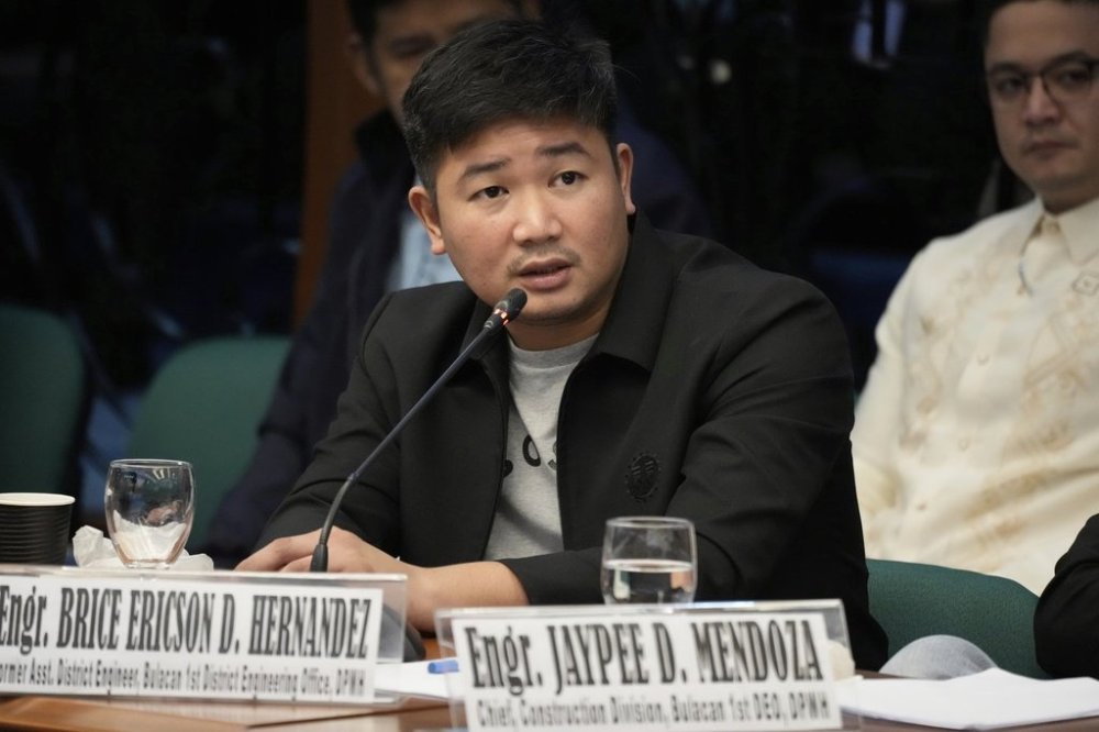Former DPWH Engineer Brice Ericson Hernandez speaks during investigations on flood-control projects at the Senate Blue Ribbon committee in Pasay city, Philippines on Tuesday, Sept. 23, 2025. (AP Photo/Aaron Favila)