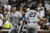 New York Yankees' Aaron Judge, left, celebrates with Giancarlo Stanton (27) after hitting a home run during the third inning of a baseball game against the Baltimore Orioles, Saturday, Sept. 20, 2025, in Baltimore. (AP Photo/Stephanie Scarbrough)